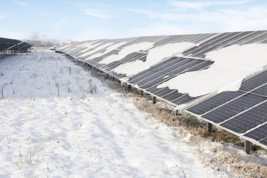 Solar panels power station with snow in winter